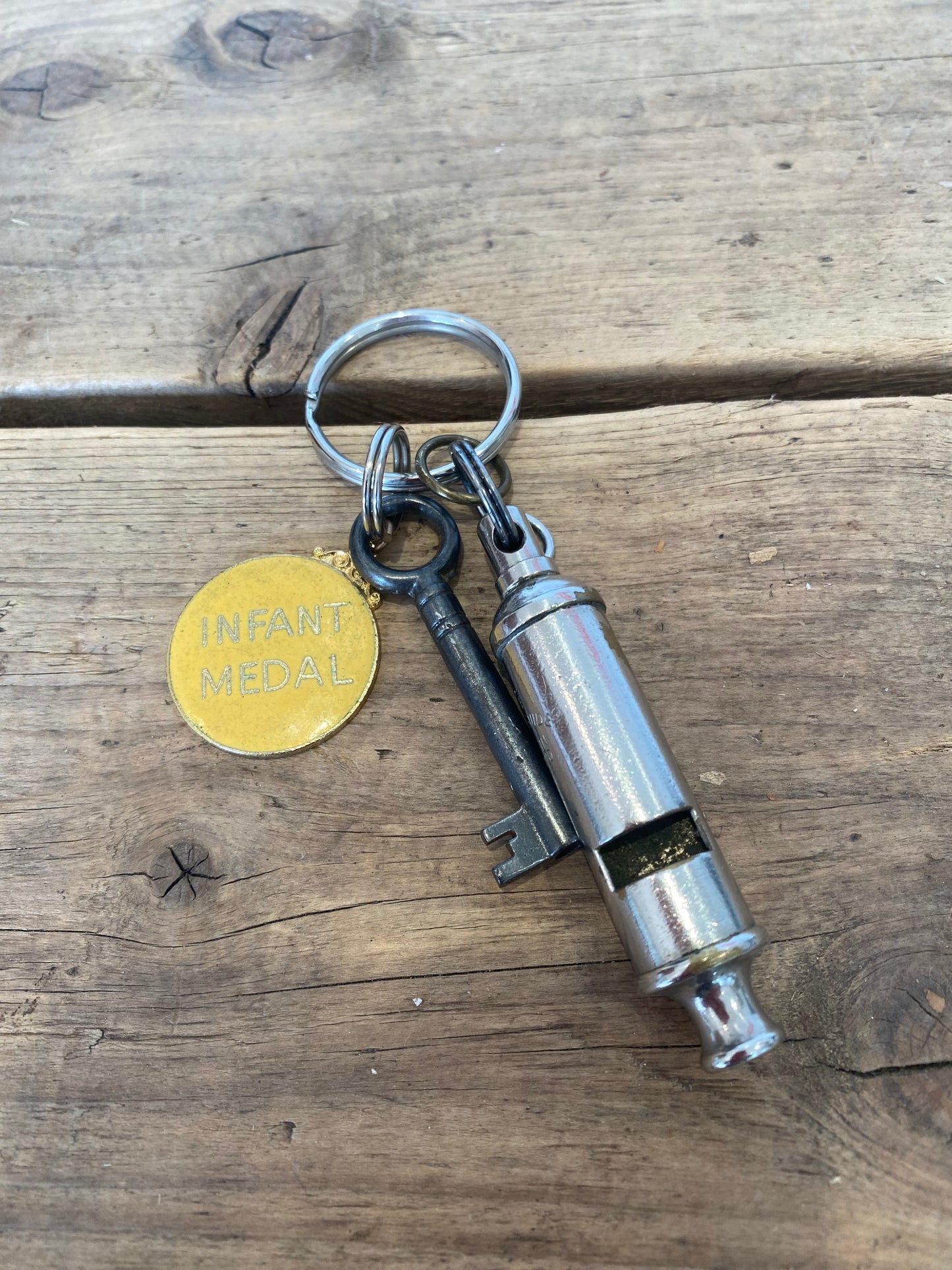 Infant medal and Whistle Key Ring
